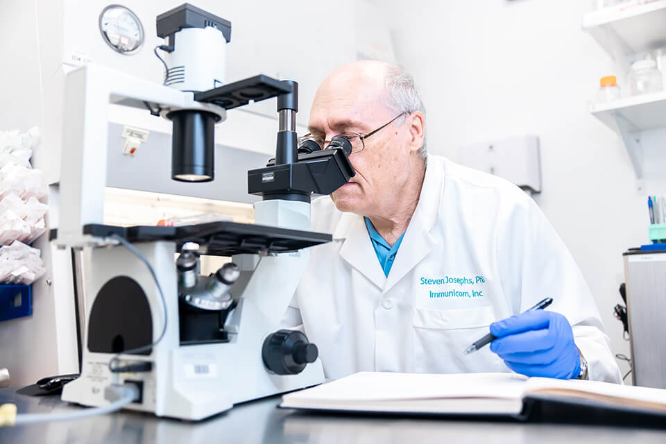 Dr. Steve looking in microscope